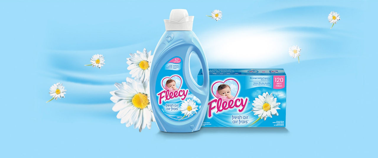 Fleecy Fresh Air liquid fabric softener and 120 dryer sheets pack on a blue background with daisies for long lasting freshness.